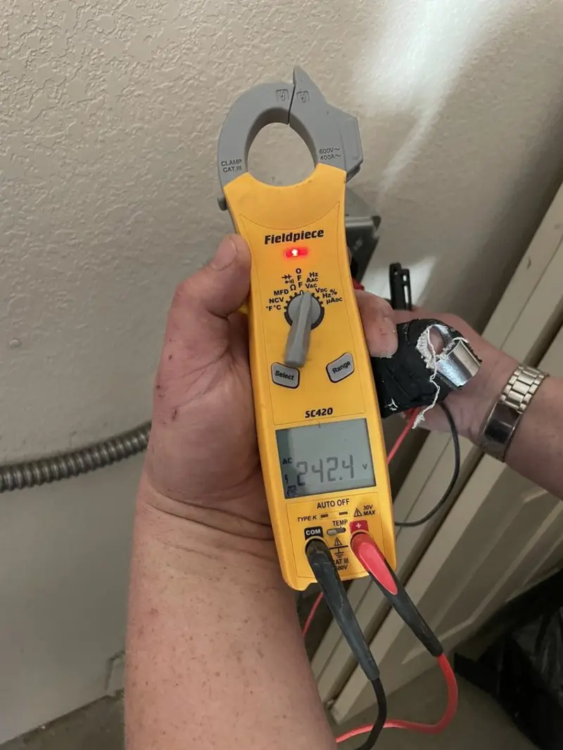 Voltage testing with clamp meter during Electrical Installation Services in Oceano